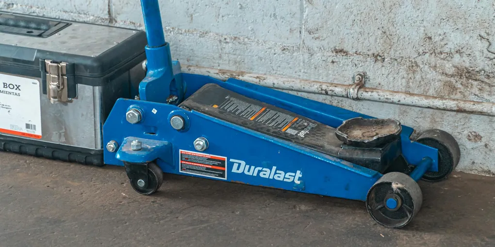Epoxy Garage Floor Cost 2026: $3–$12/sq ft ($1,200–$6,000 Two-Car)